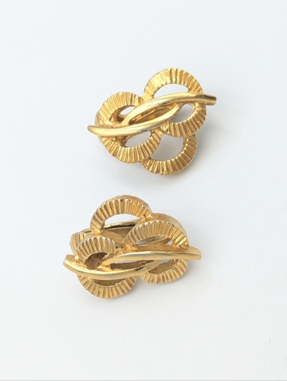 4/24$    Gold tone textured knot clip on earrings